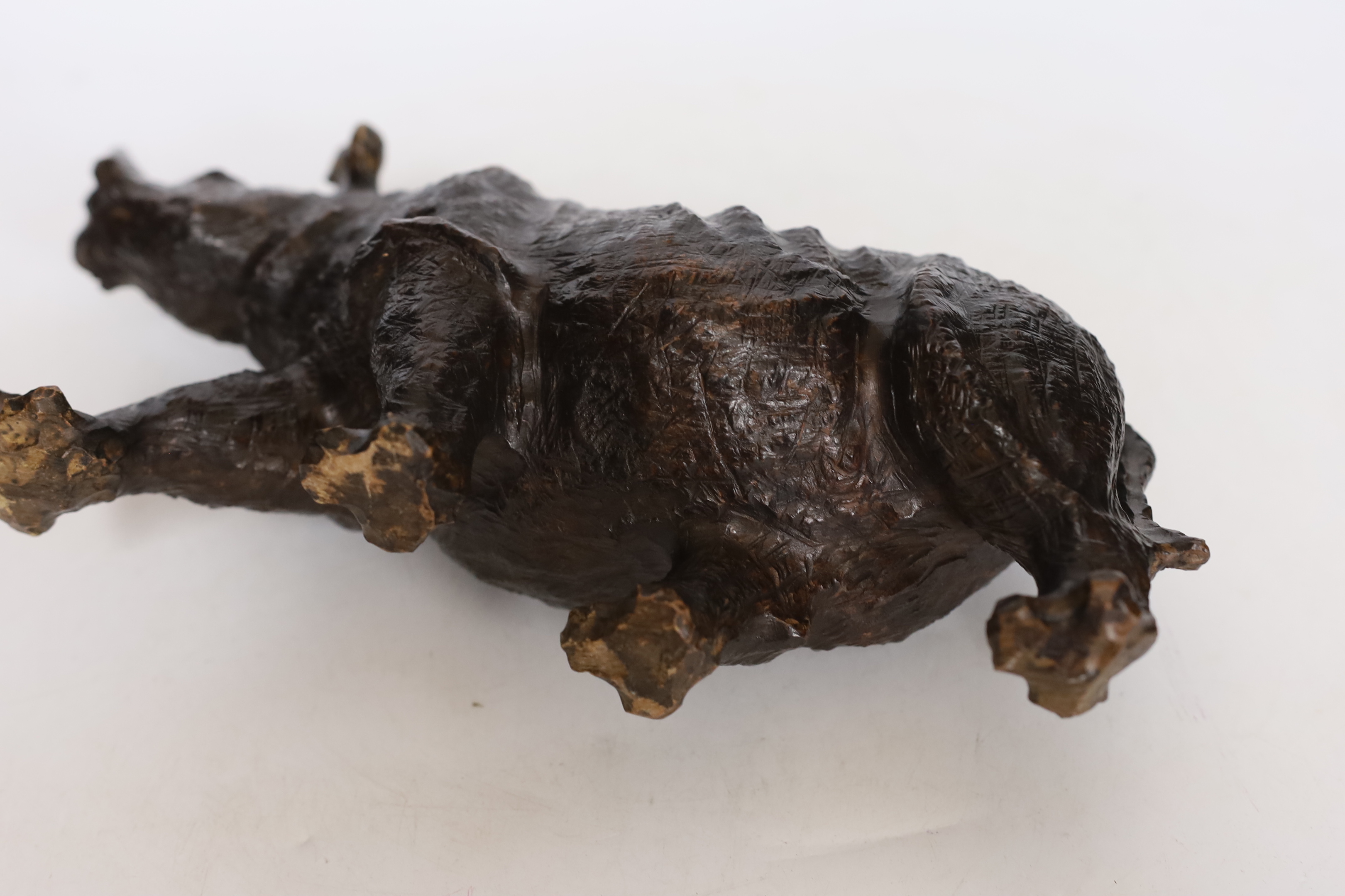 A carved heavy rootwood model of a rhinoceros, 33cm